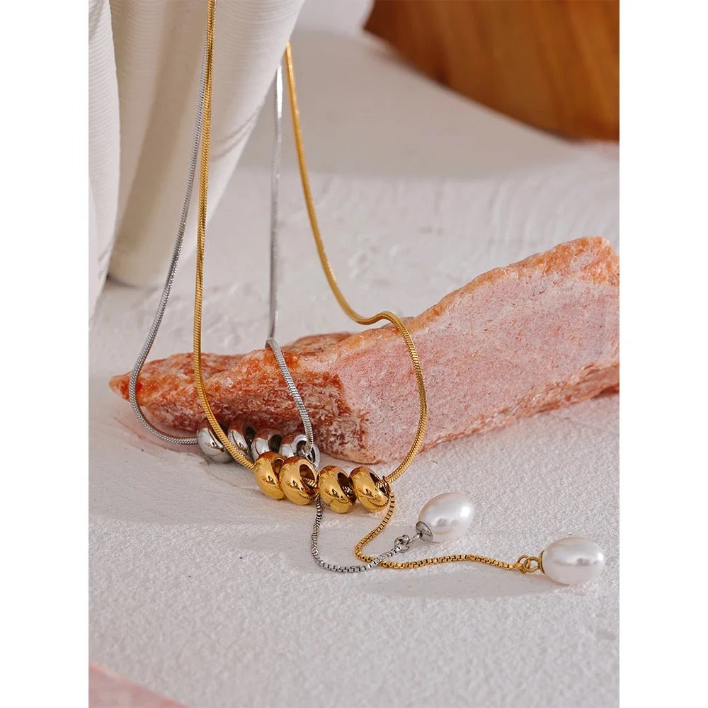 Round beads with pearl drop necklace