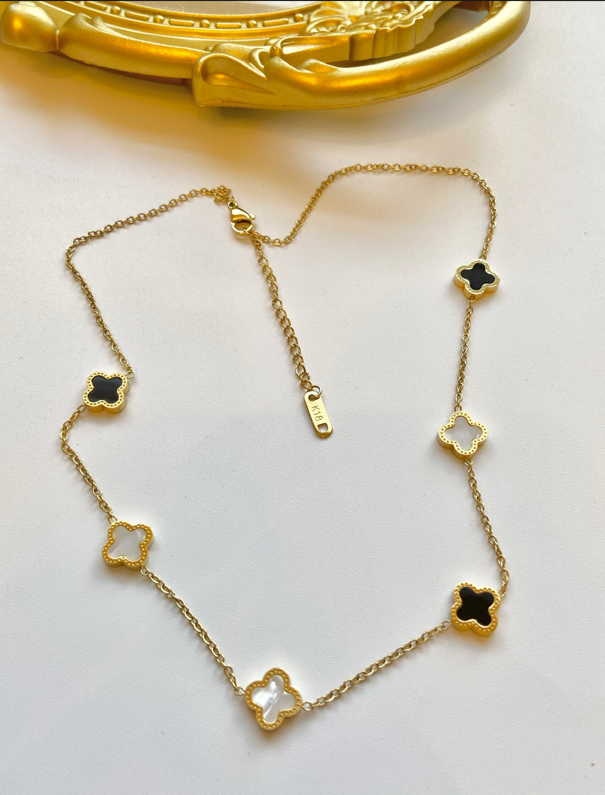 Black and white clover necklace