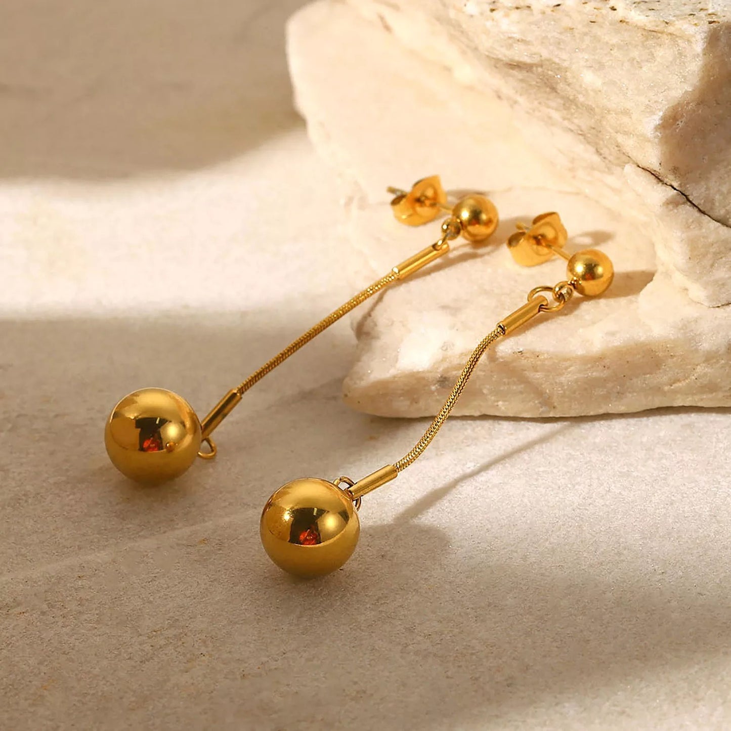 Ball pedant long stud earrings
