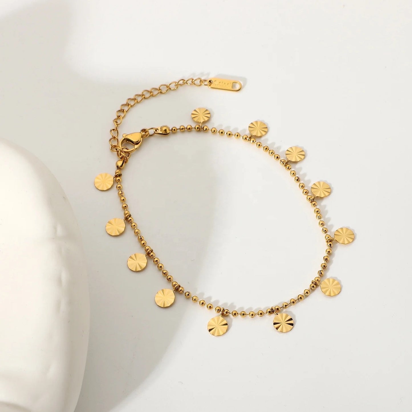 Disc anklet