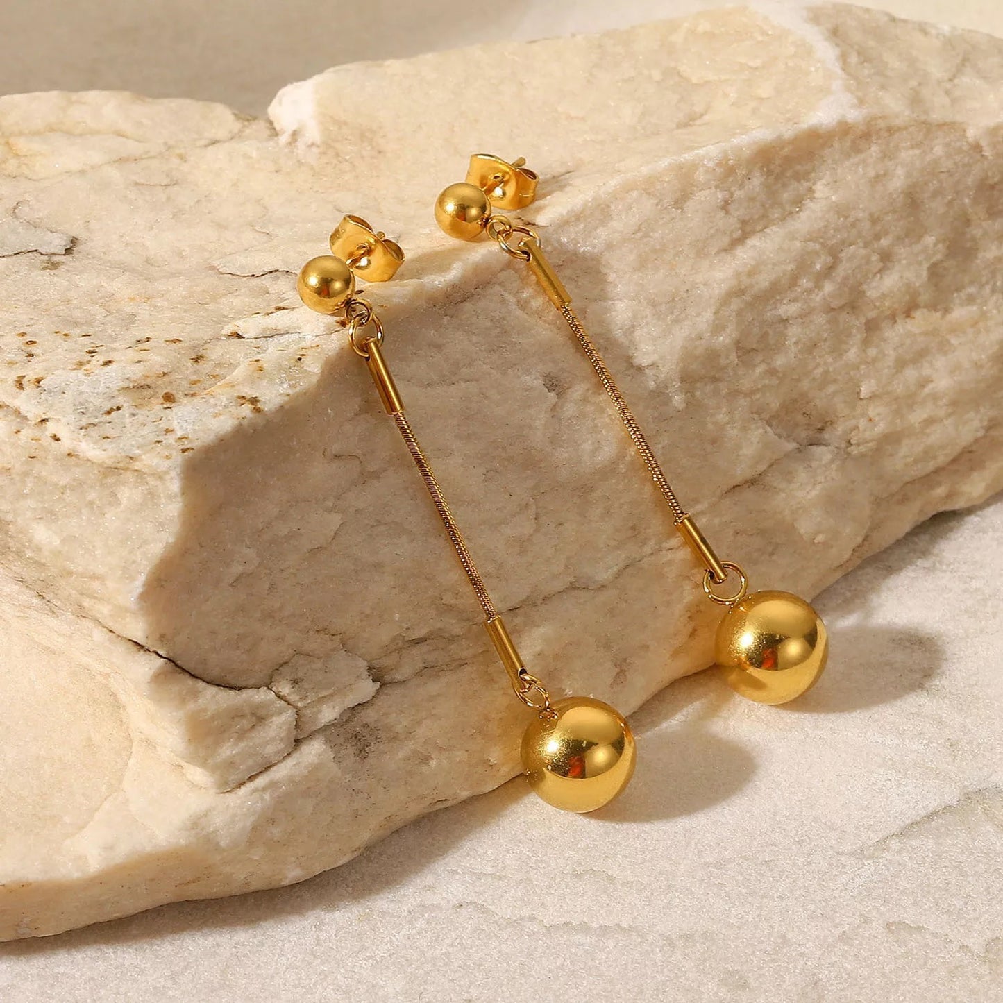 Ball pedant long stud earrings